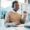 Call center, black man and consulting at computer for telemarketing, customer service and IT suppor
